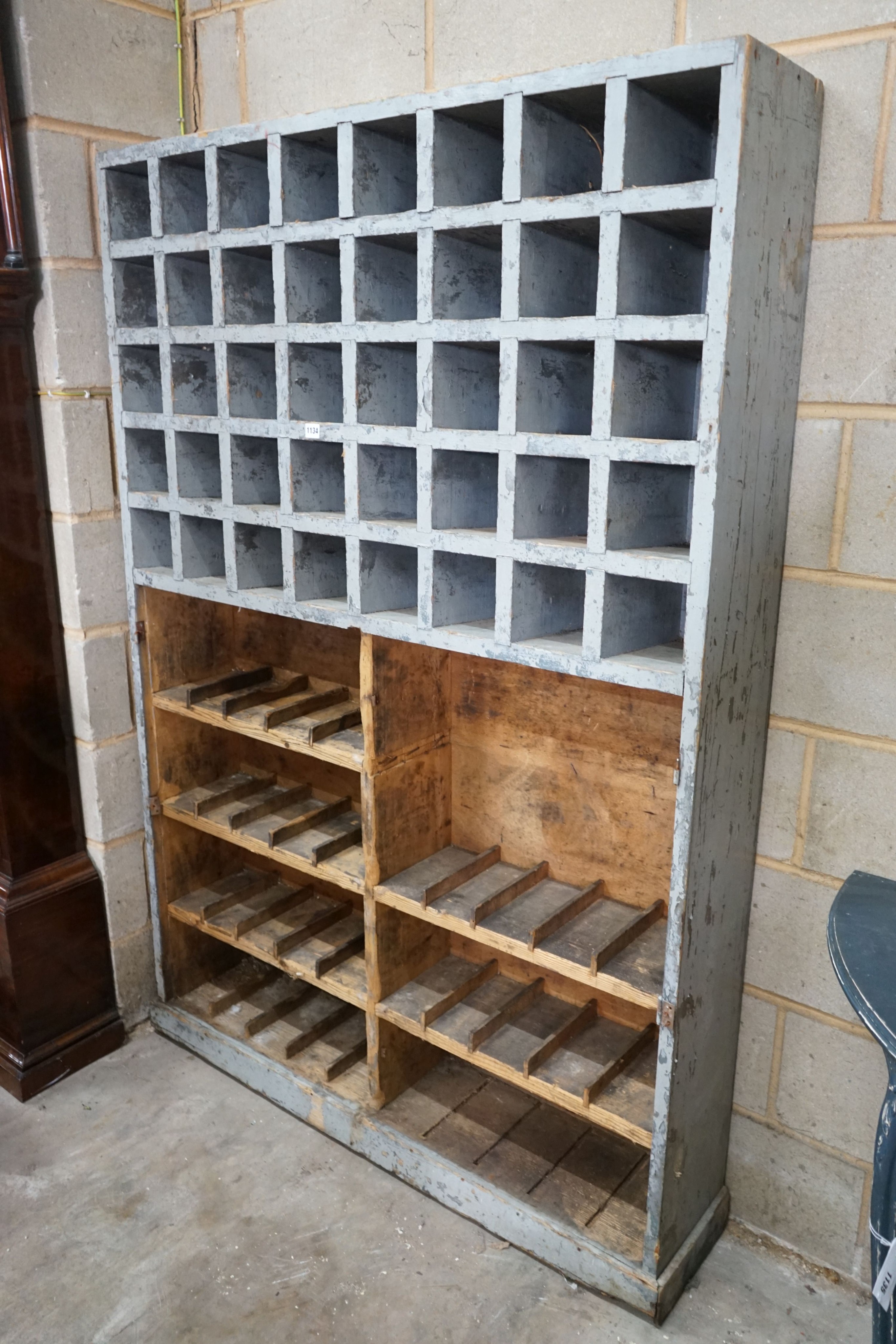 A vintage painted pine pigeonhole / unit, width 123cm, depth 16cm, height 182cm